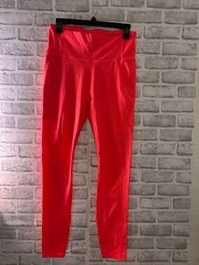 Fabletics High-Waisted Pocket Leggings in Neon Coral